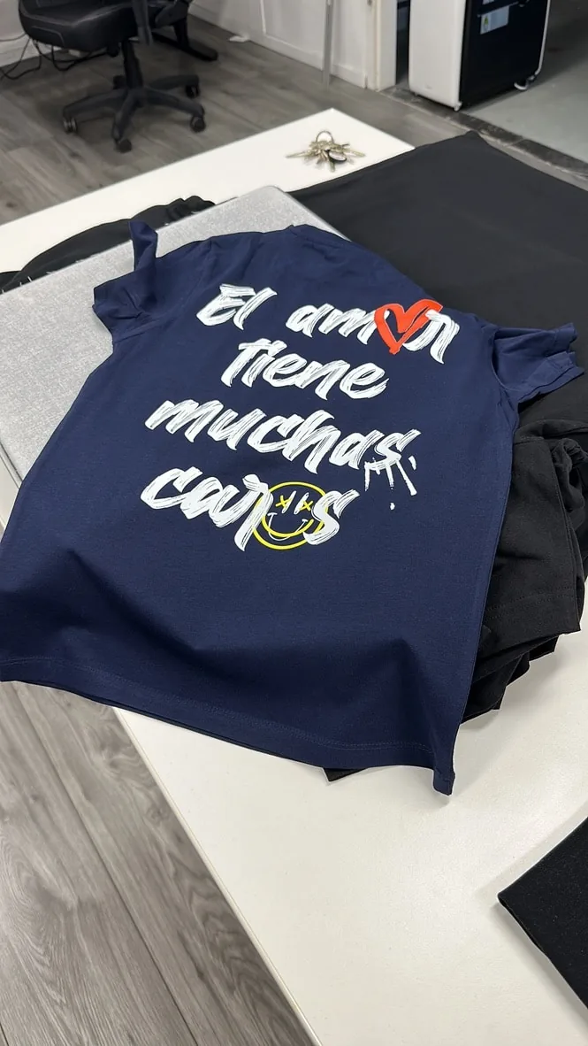 Navy T-shirt with a colourful DTF print, made at AJDN