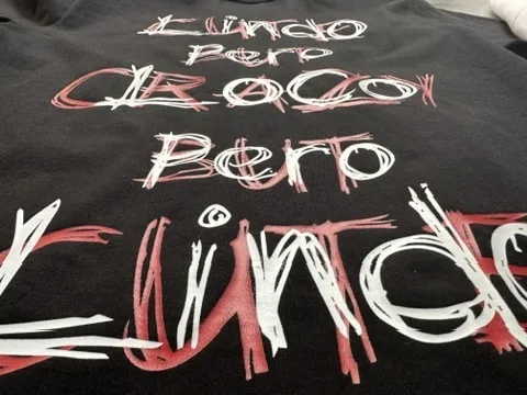 DTF print with red and white lettering on a black shirt